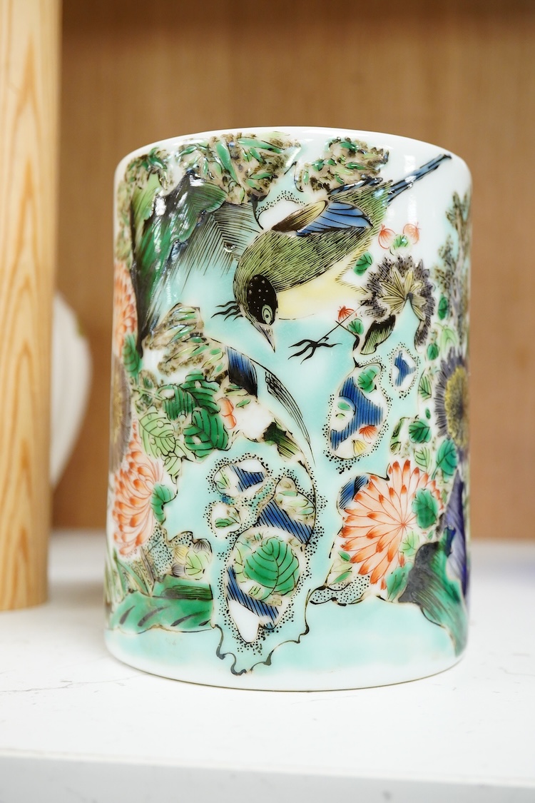 A Chinese famille verte cylindrical brush pot, decorated with birds and flowers, 13cm high